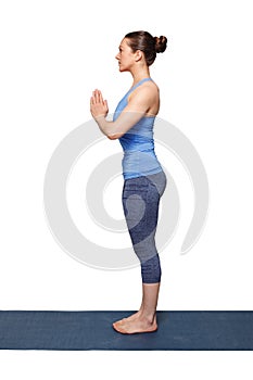 Woman doing Hatha Yoga asana Tadasana photo