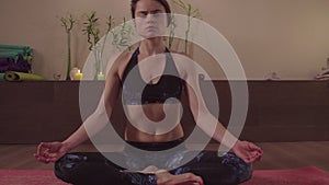 Woman doing kriya yoga - agnisara dhauti