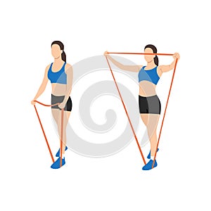 Woman doing lateral raises with resistance band