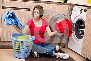 The woman doing laundry at home