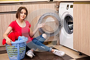 The woman doing laundry at home