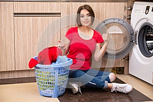 The woman doing laundry at home