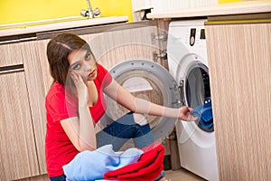 The woman doing laundry at home