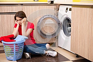 The woman doing laundry at home