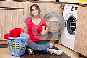 The woman doing laundry at home