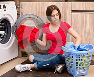 Woman doing laundry at home