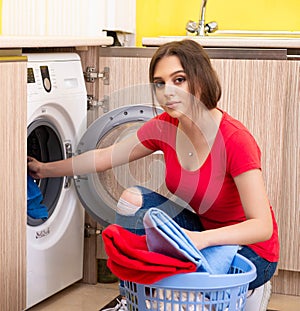 Woman doing laundry at home