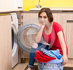 Woman doing laundry at home