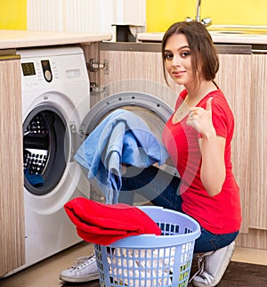 Woman doing laundry at home