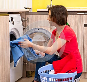 Woman doing laundry at home