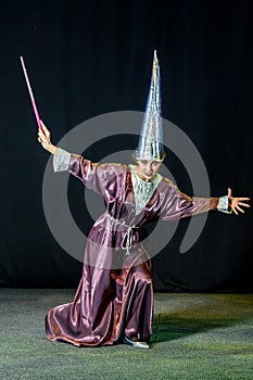 woman doing magic on a dark background