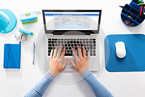 Woman Doing Online Banking On Laptop