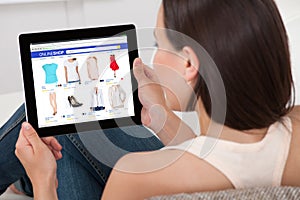 Woman Doing Online Shopping On Digital Tablet photo