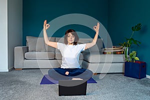 Woman is doing online yoga