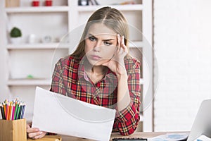 Woman doing paperwork in office