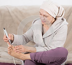 Woman doing pedicure