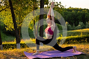 Woman is doing physical exercise in the morning, while no one is bothering her.