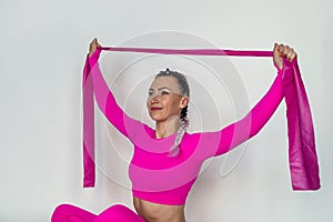 woman doing pilates and fitness with sports bands isolated silhouette on white background.