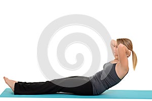 Woman doing pilates neck pull