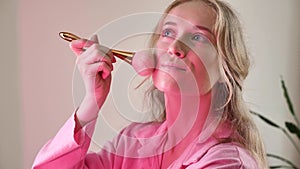 Woman doing pink makeup Barbie for party