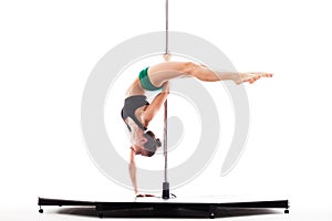 Woman doing pole dance, isolated on white