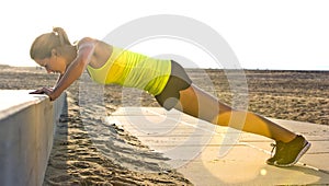 Woman doing Press ups on a beach