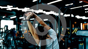 Woman doing a pull-up in gym