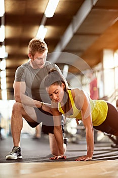 Woman doing pushups with assist