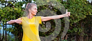woman doing qi gong outdoors photo