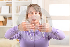 Woman doing qi gong tai chi exercise