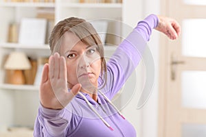 Woman doing qi gong tai chi exercise