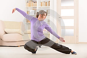 Woman doing qi gong tai chi exercise