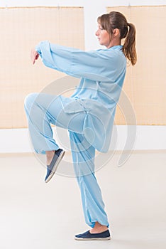 Woman doing qi gong tai chi exercise