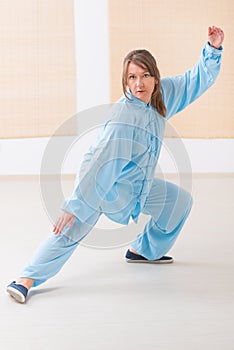 Woman doing qi gong tai chi exercise