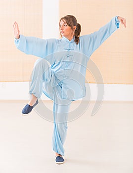 Woman doing qi gong tai chi exercise