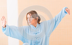 Woman doing qi gong tai chi exercise