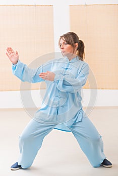 Woman doing qi gong tai chi exercise