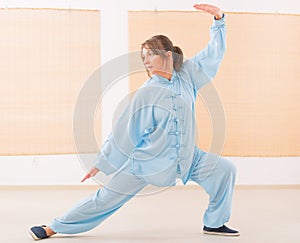 Woman doing qi gong tai chi exercise