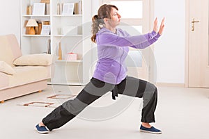 Woman doing qi gong tai chi exercise