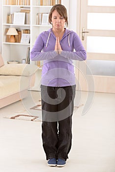 Woman doing qi gong tai chi exercise