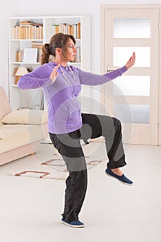 Woman doing qi gong tai chi exercise