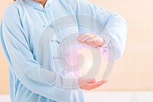 Woman doing qi gong tai chi exercise