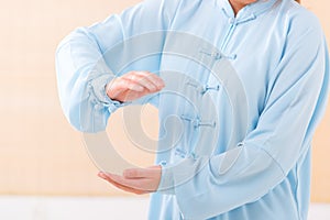 Woman doing qi gong tai chi exercise