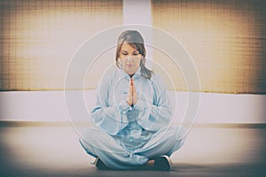 Woman doing qi gong tai chi exercise