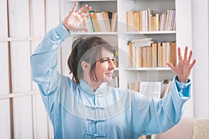 Woman doing qi gong tai chi exercise