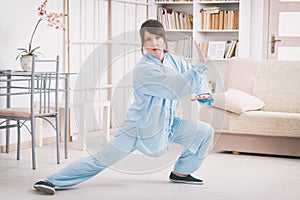 Woman doing qi gong tai chi exercise