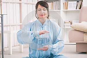 Woman doing qi gong tai chi exercise