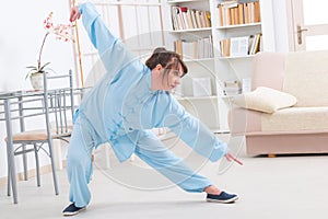 Woman doing qi gong tai chi exercise