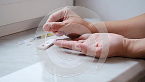 A woman doing a rapid test at home to determine the coronavirus, COVID 19