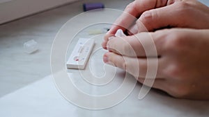 A woman doing a rapid test at home to determine the coronavirus, COVID 19